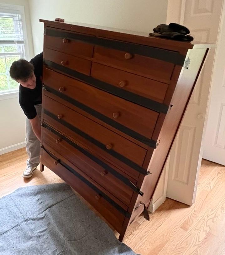 Furniture removal — dresser removal in progress
